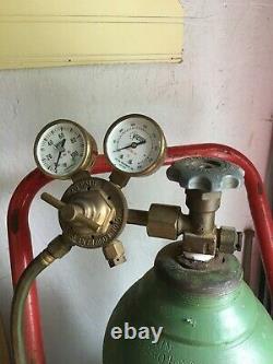 Welding/cutting oxygen and acetylene tanks, cat, torch, gauges hose